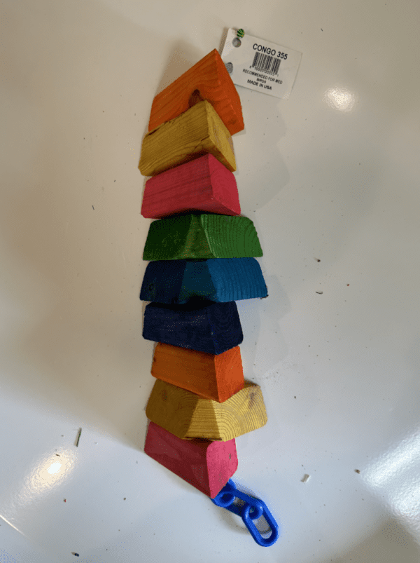 A stack of colorful Congo blocks on a white plate.